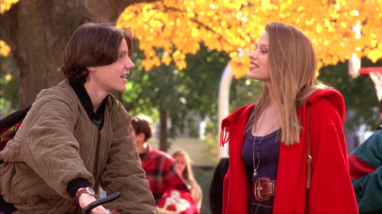 Max and Allison speaking on an autumn day