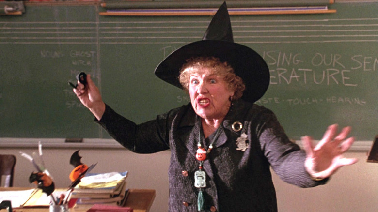 Miss Olin teaching while dressed as a witch