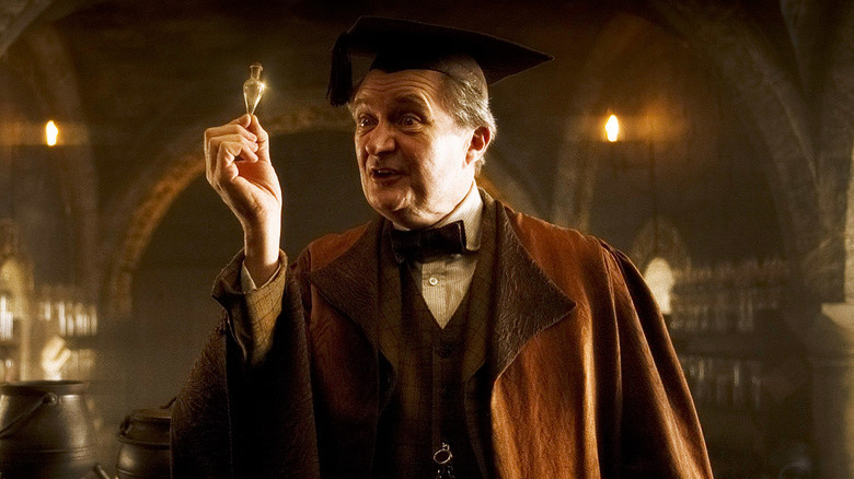 Horace Slughorn holding vial 