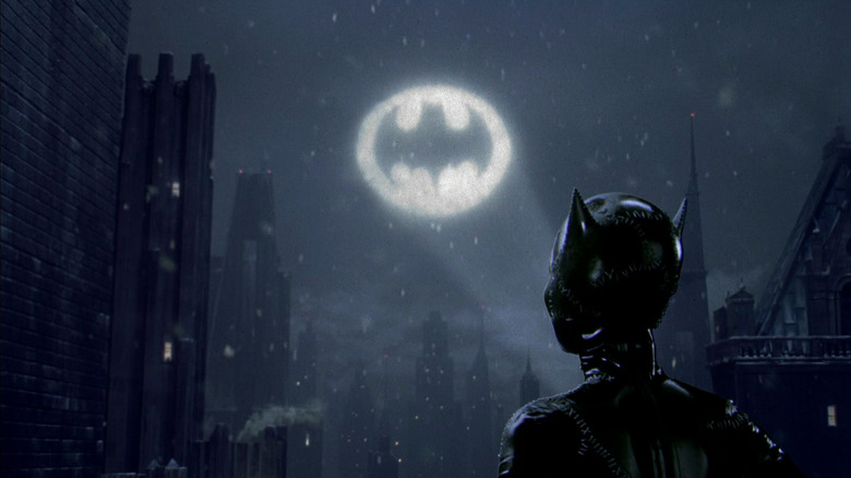 Catwoman looking at bat signal 