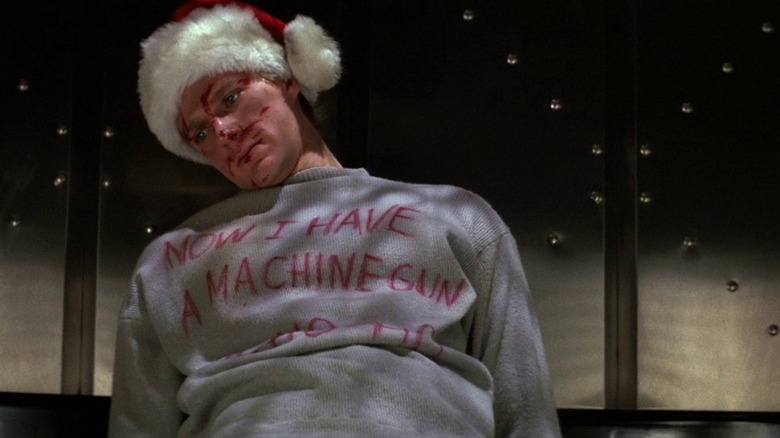 Dead henchman wearing santa hat