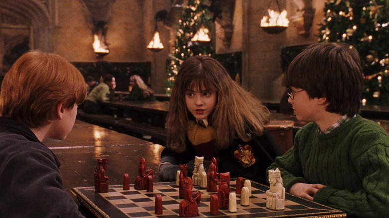 Harry, Ron, and Hermione playing chess