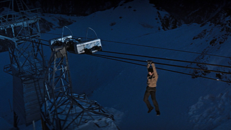 James Bond hanging onto wire