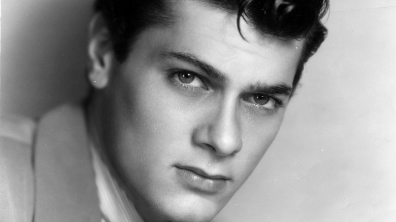 Tony Curtis looks directly at you