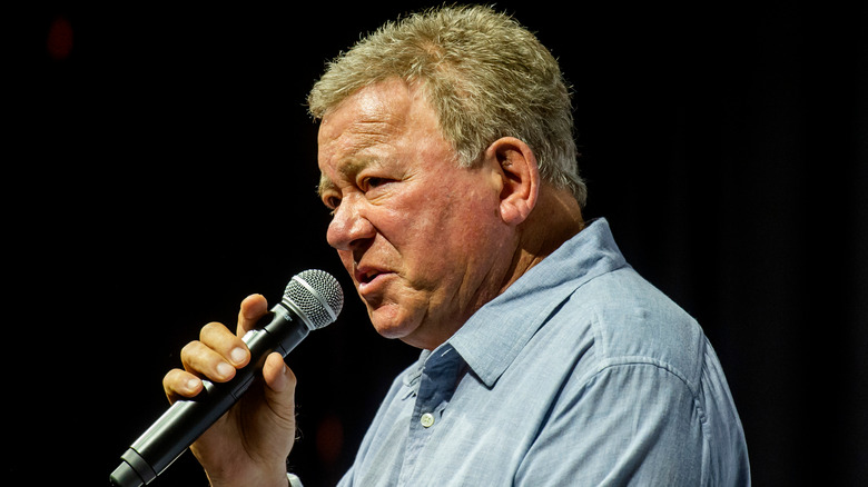 William Shatner talks into a microphone