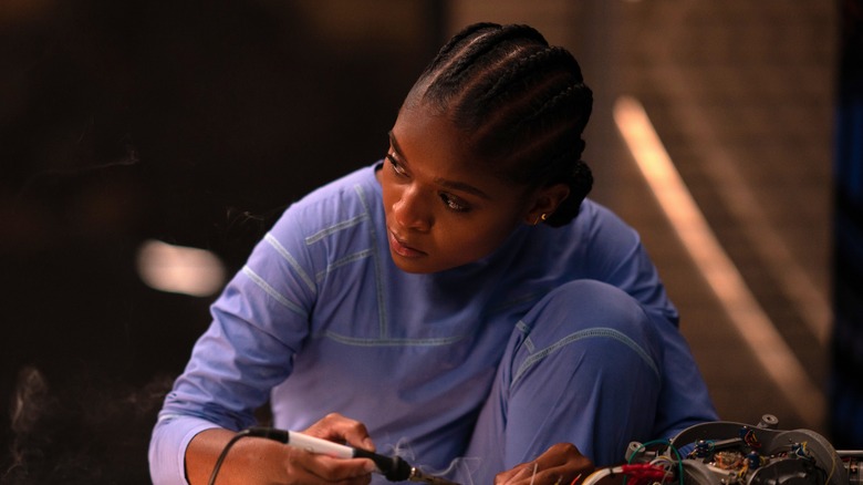 Riri Williams solders a circuit