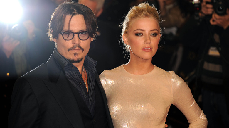 Johnny Depp and Amber Heard posing for a photo