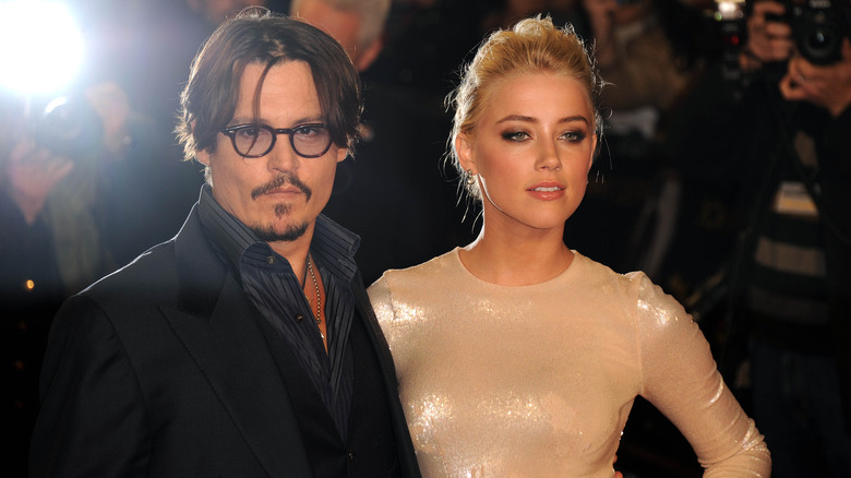 Johnny Depp and Amber Heard posing for a photo