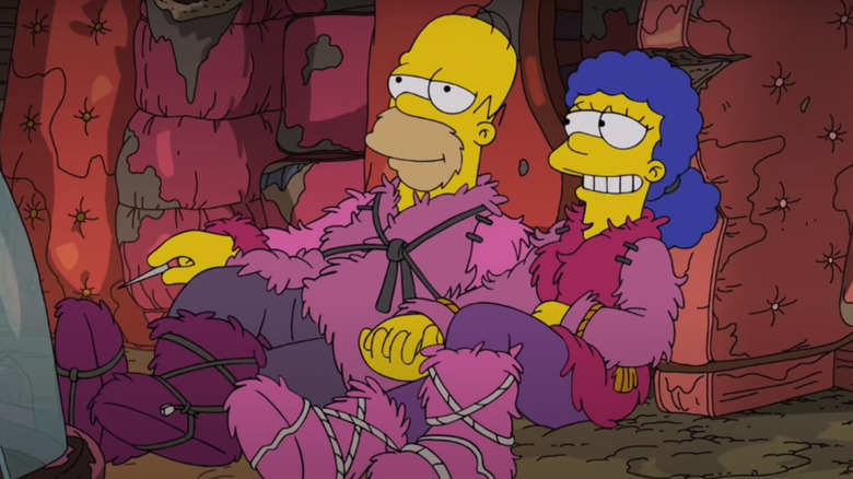 Homer and Marge sit in couch fort