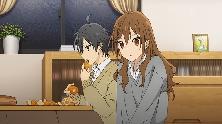 Hori and Miya eating oranges