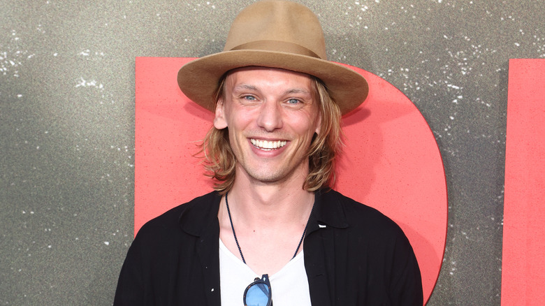 Jamie Campbell Bower smiling