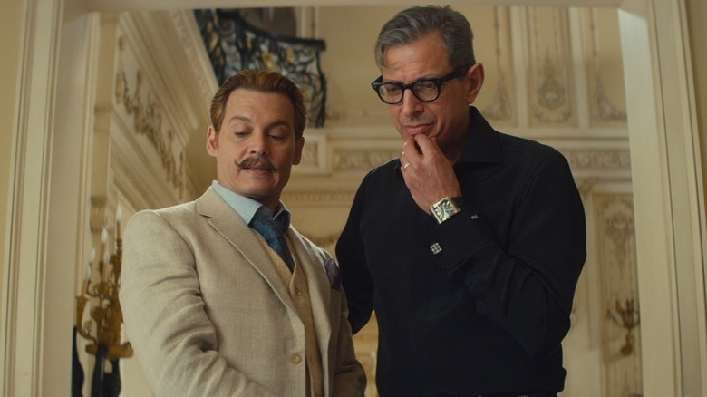 Charlie Mortdecai looking at something with Krampf