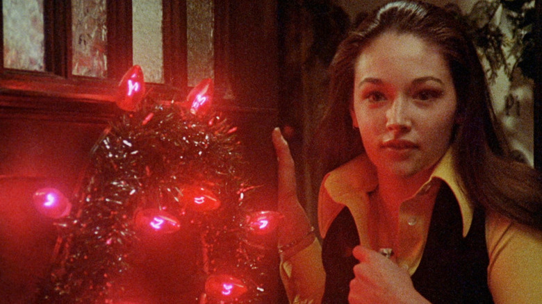 Olivia Hussey with Christmas wreath