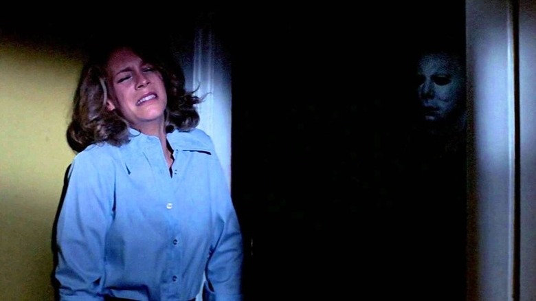 Laurie cries next to Michael Myers