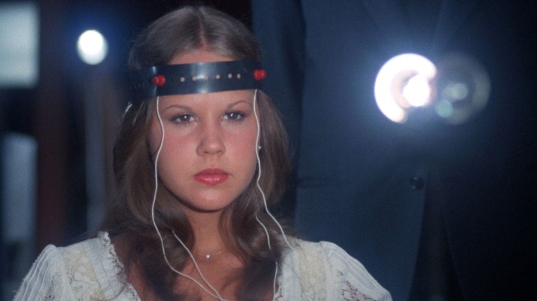 Regan McNeil wears the synchronizer's headband in "Exorcist II" (1977)