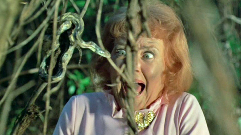 Iris screams at a snake in a tree in "Frogs" (1972)