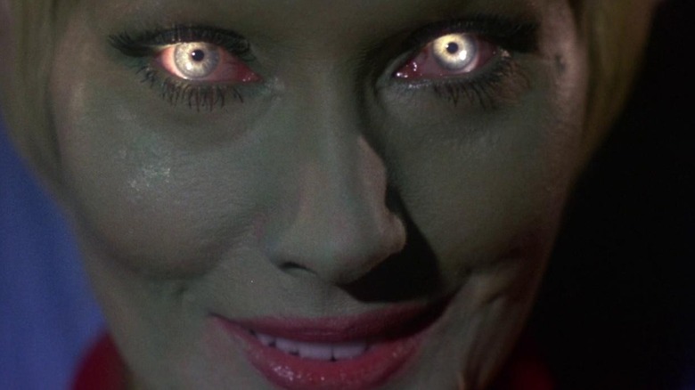 The Alien Queen smiles as her eyes glow in "Queen of Blood" (1966)