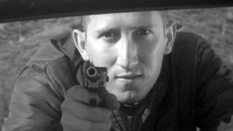 Mad Dog Click points gun in "The Thrill Killers" (1966)