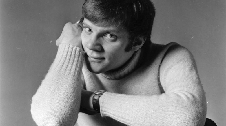 Malcolm McDowell wearing a sweater