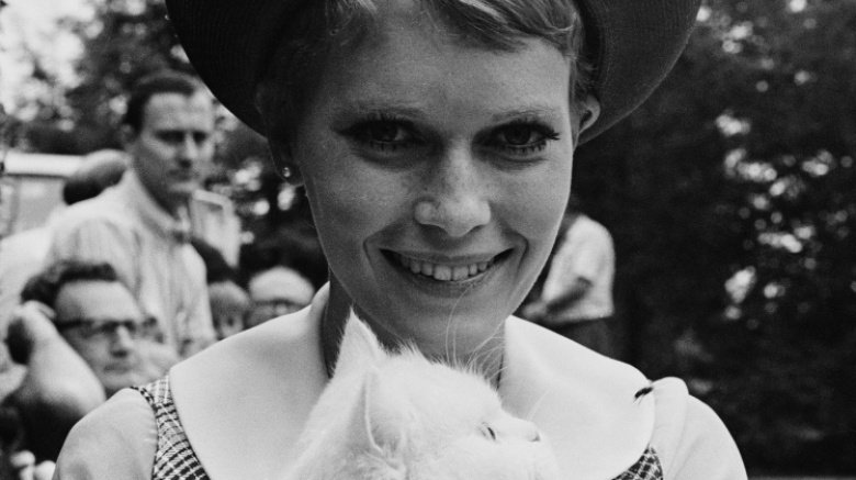 Mia Farrow holds cat