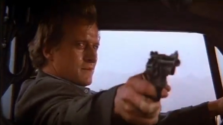 John Ryder aims gun