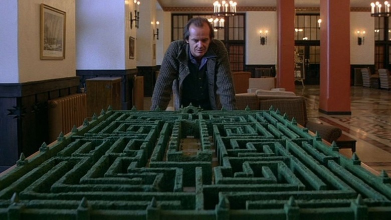 Jack Torrance leans over maze