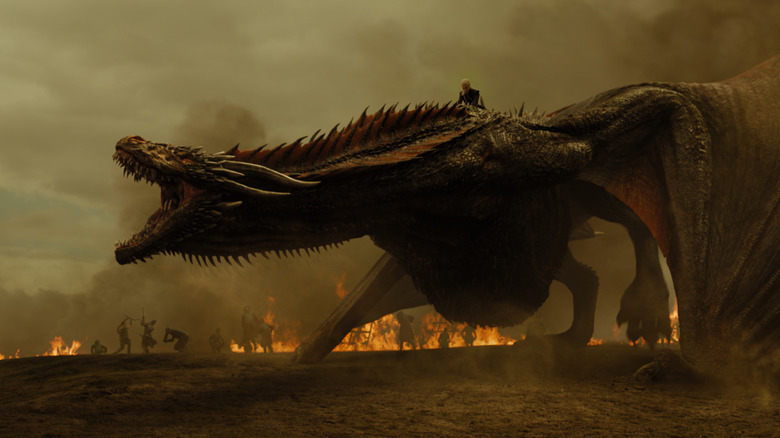 Daenerys riding Drogon