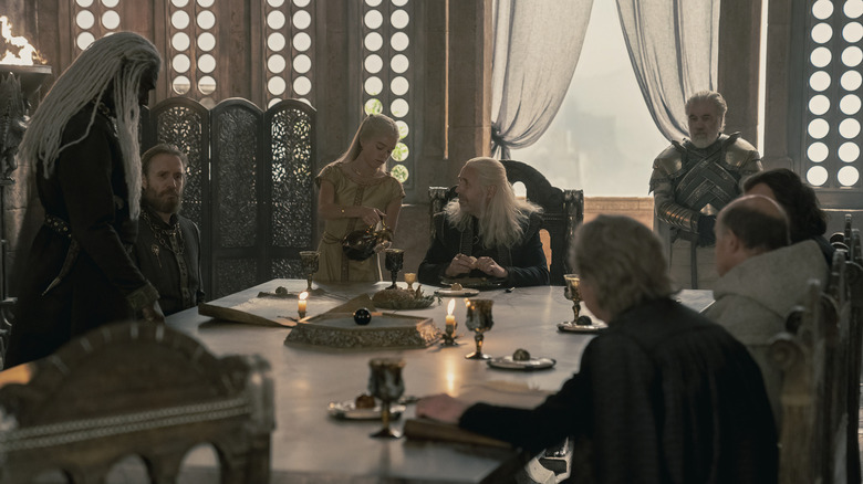 King Viserys leading the small council