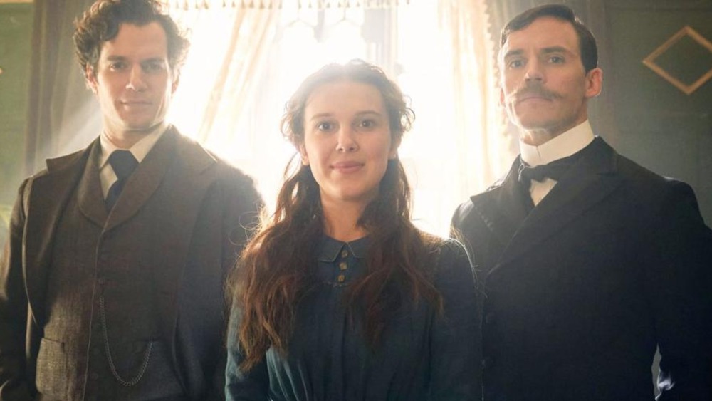 Henry Cavill as Sherlock Holmes, Millie Bobby Brown as Enola Holmes, and Sam Claflin as Mycroft Holmes in Enola Holmes