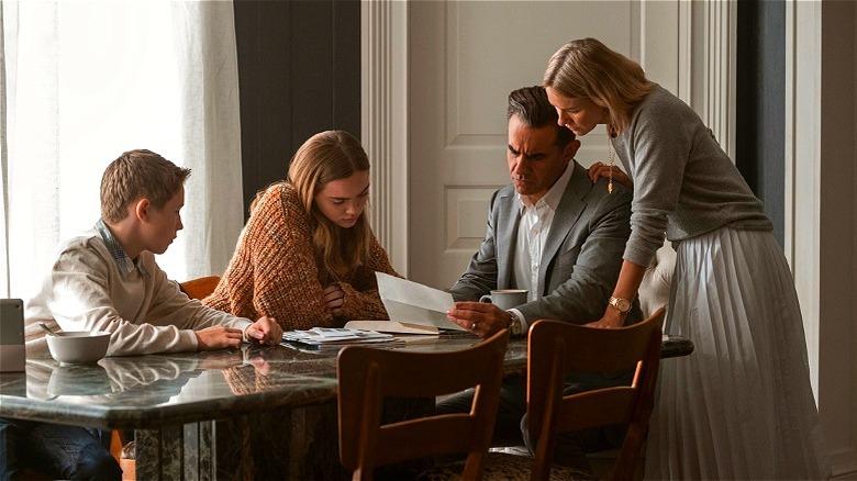 The Brannock family huddled around the letter