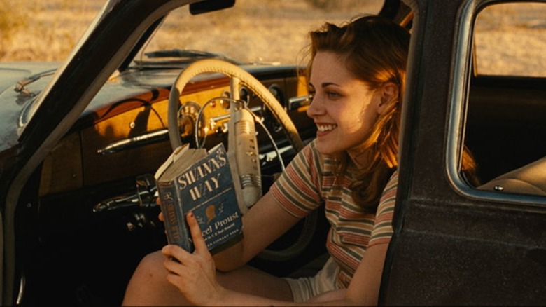 Marylou reading book in car