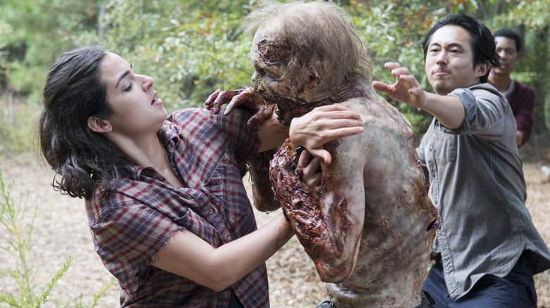 Tara and Glenn grappling with a walker