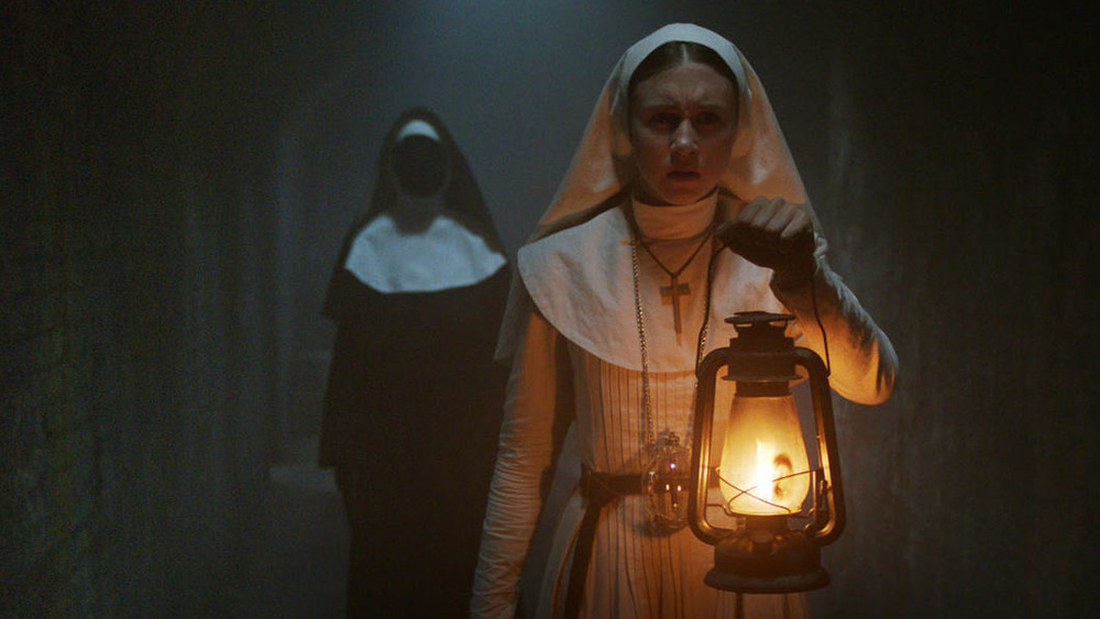 Sister Irene holding lantern