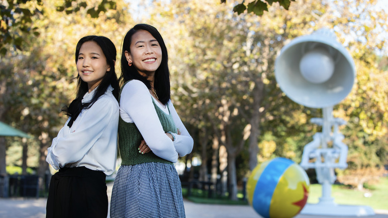 Rosalie Chiang and Domee Shi from Pixar's Turning Red posing outside