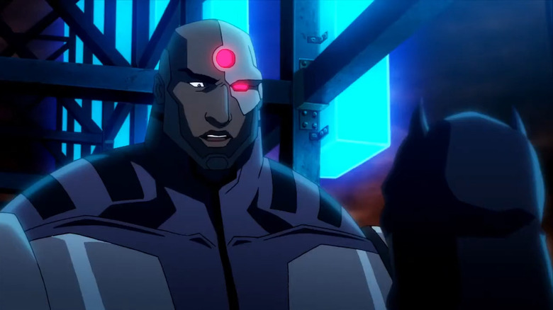 Cyborg stands over Batman