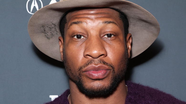 Jonathan Majors wearing hat