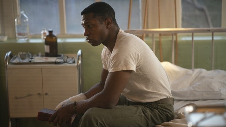 Jonathan Majors plays a man in repose