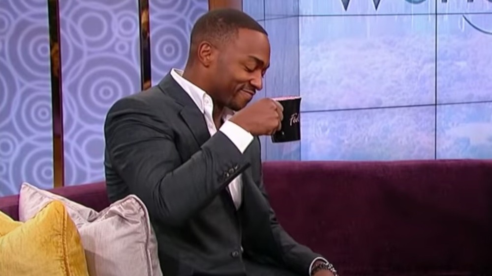 Anthony Mackie sipping drink