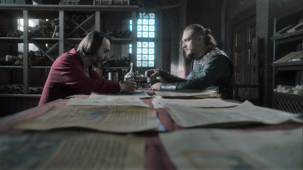 David Dawson and Alexander Dreymon as Alfred and Uhtred looking over the King's Chronicle in The Last Kingdom 