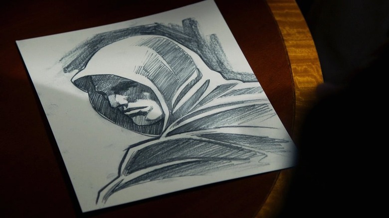 Sketch of a hooded man