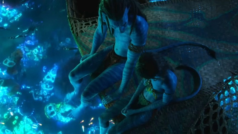 Two Na'vi sitting and talking