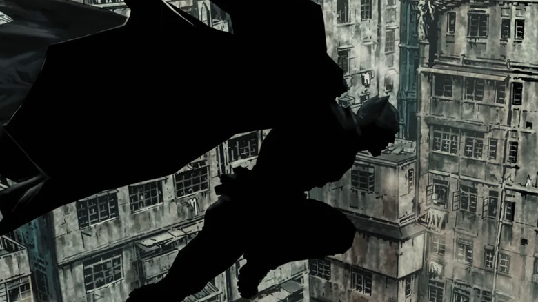 Batman leaps across Gotham's decrepit buildings