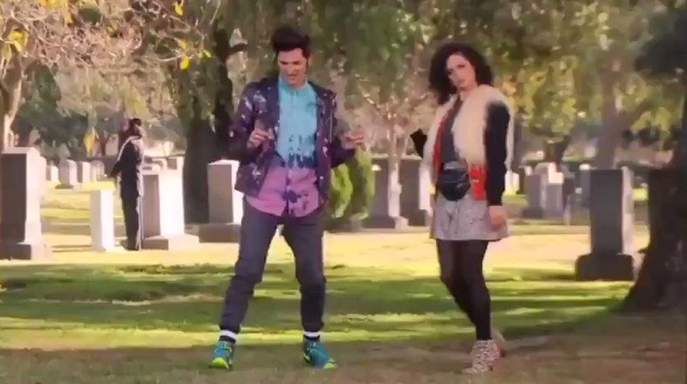 Jean Ralphio and Mona Lisa dance through a cemetery