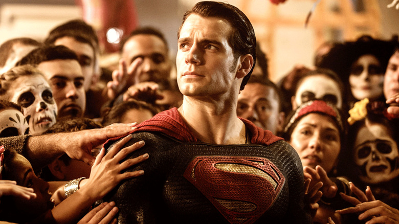 Superman standing in the middle of a crowd