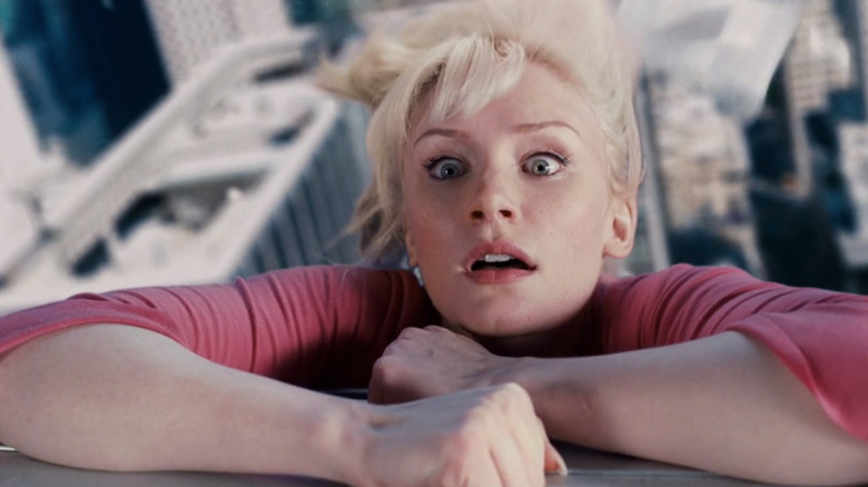 Gwen Stacy hanging onto side of building