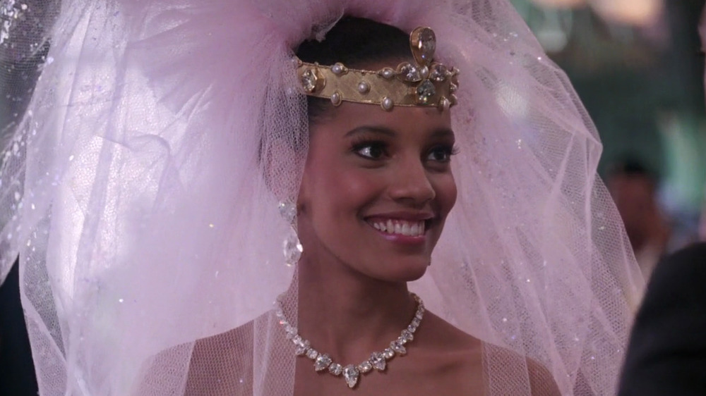 Lisa McDowell in pink wedding dress and crown smiling