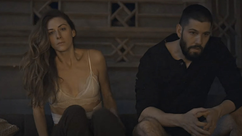 Perry Mattfeld and Casey Deidrick sitting together in scene from In the Dark