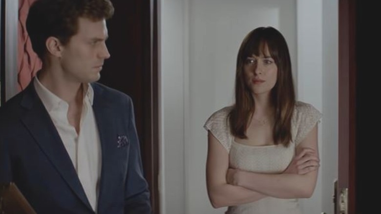 Christian Grey and Anastasia Steele walking into Grey's sex playroom