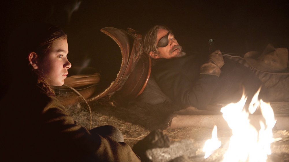 Hailee Steinfeld as Mattie Ross and Jeff Bridges as Rooster Cogburn in True Grit