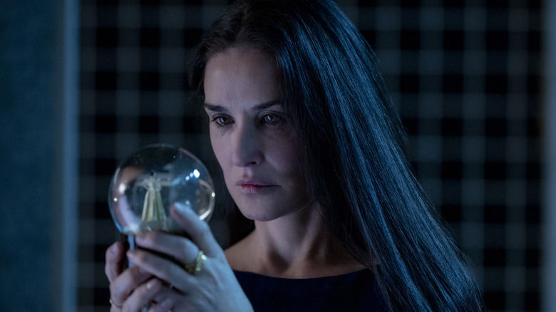 Elisabeth Sparkle looking into crystal ball